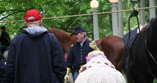Captain Milburn chats with visitors to the camp about the role of the cavalry soldier